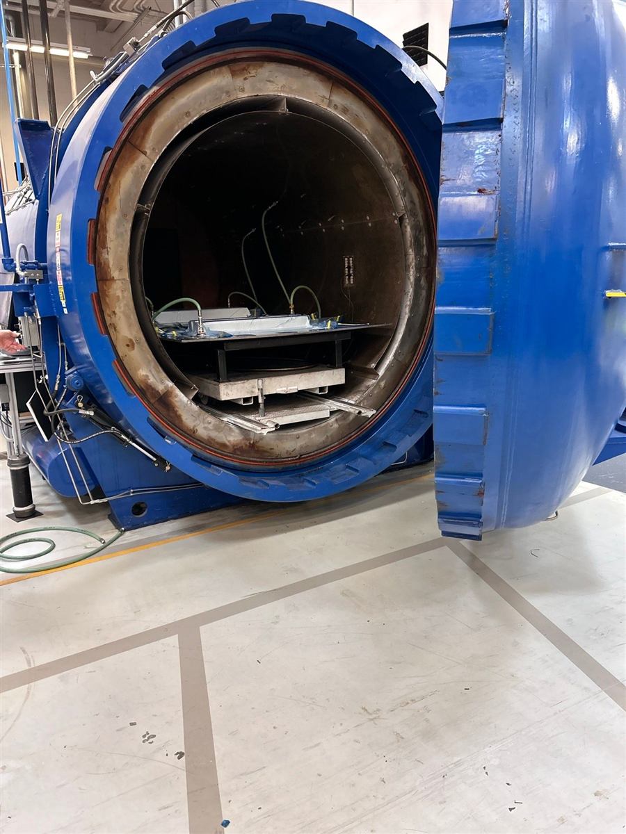 Open autoclave with a part loaded inside