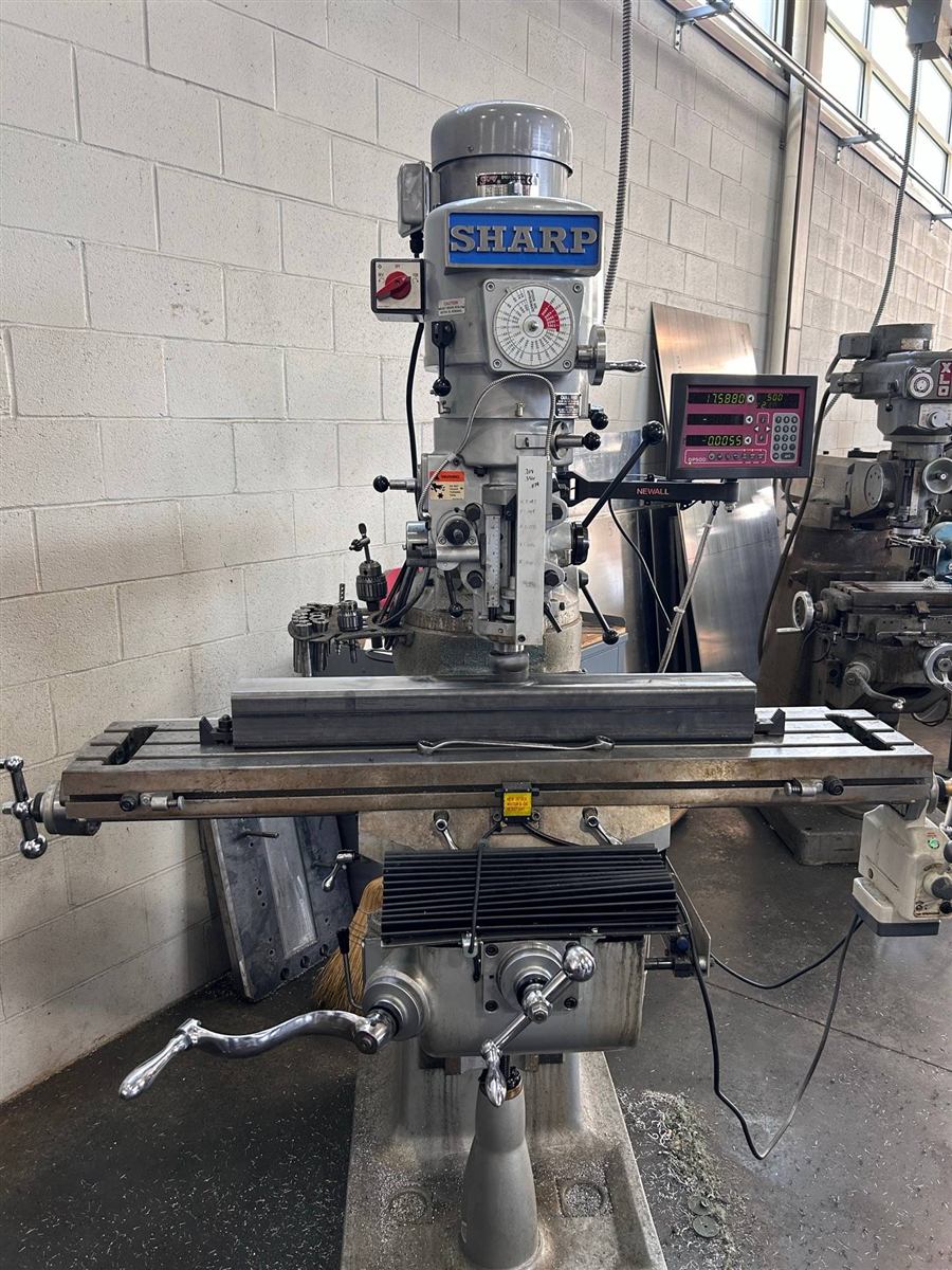 Steel tube clamped on a Sharp milling machine