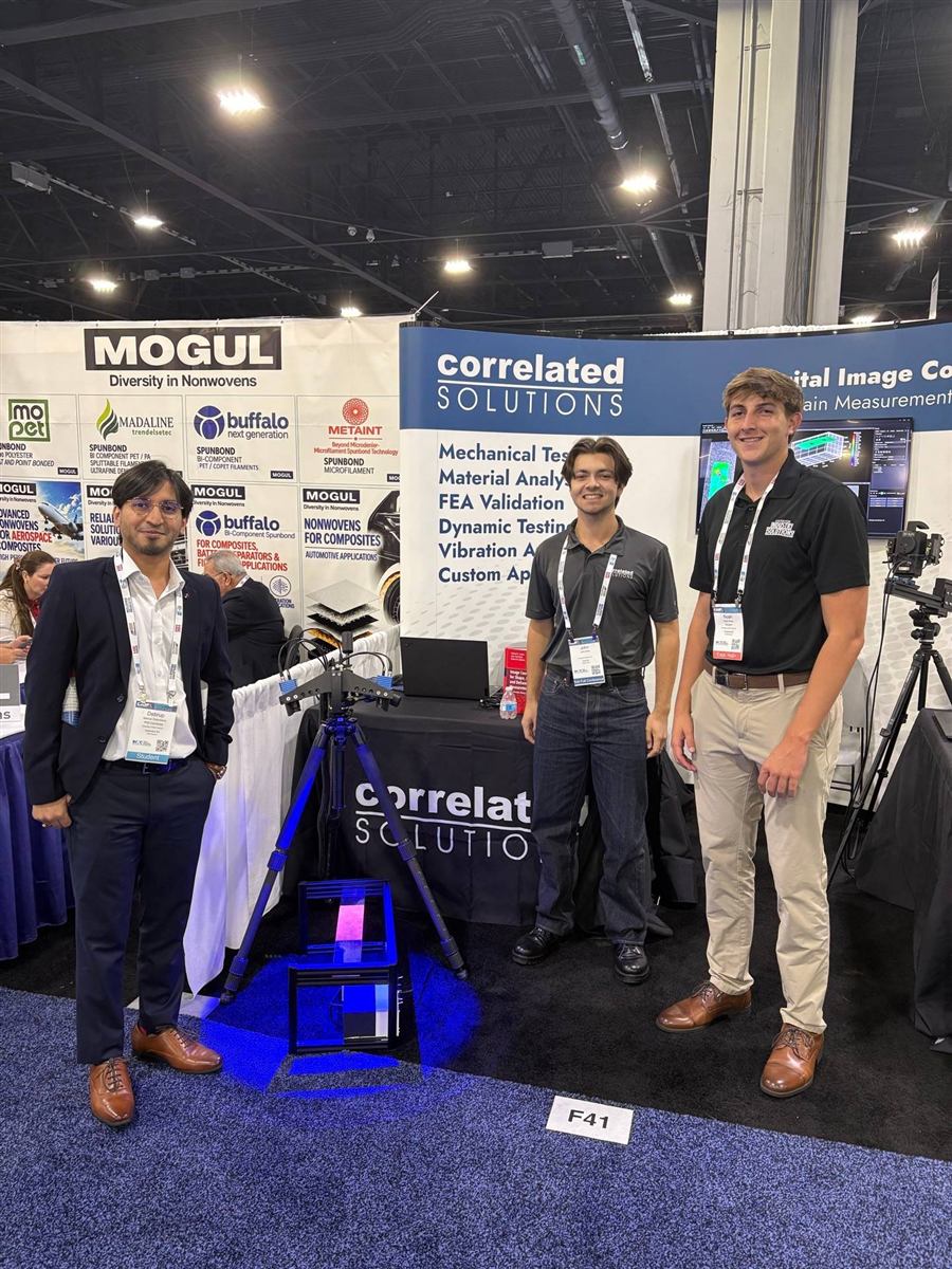 Noah Carter with colleagues at the Correlated Solutions booth, booth F41